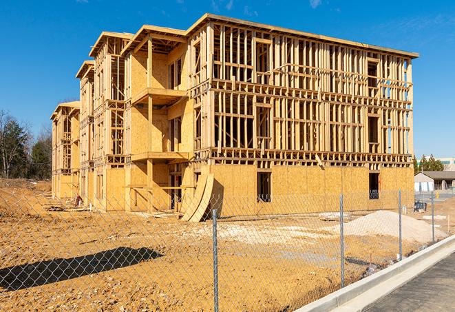 a job site enclosed by temporary chain link fences, ensuring safety for workers and pedestrians in Dayton TN